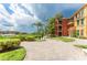 Well-maintained walkway with brick pavers, lush landscaping and peaceful canal views at 2741 Via Cipriani # 934B, Clearwater, FL 33764