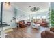 Bright living room with a stylish coastal decor, wood floors, and ample seating at 2741 Via Cipriani # 934B, Clearwater, FL 33764