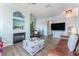 Cozy living room with a brick fireplace, wood flooring, and a spacious layout at 2741 Via Cipriani # 934B, Clearwater, FL 33764