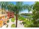 Scenic water view with lush landscaping, condo buildings, and boat docks under sunny skies at 2741 Via Cipriani # 934B, Clearwater, FL 33764