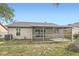 The backyard features a large screened patio for entertaining and a beautiful view at 3058 Cara Ct, Palm Harbor, FL 34684