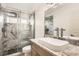 Modern bathroom featuring a frameless glass shower, marble tile, and a vessel sink with stylish faucet at 3058 Cara Ct, Palm Harbor, FL 34684