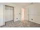 Neutral bedroom featuring plush carpeting, a double door closet, and a bright, freshly painted white color palette at 3058 Cara Ct, Palm Harbor, FL 34684