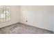 Empty bedroom featuring carpet and plantation shutters, awaiting personalization for comfort and style at 3058 Cara Ct, Palm Harbor, FL 34684