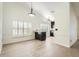 Dining space boasting natural light from large windows, wood look flooring and views to the kitchen at 3058 Cara Ct, Palm Harbor, FL 34684