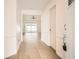 Light and bright foyer with wood look tile flooring, neutral paint and an open floorplan at 3058 Cara Ct, Palm Harbor, FL 34684