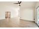 Expansive living room with an open floor plan, neutral paint and wood look flooring at 3058 Cara Ct, Palm Harbor, FL 34684