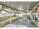 Spacious screened patio with concrete flooring, offering a versatile outdoor living area and privacy at 3058 Cara Ct, Palm Harbor, FL 34684