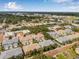 Wide aerial view highlighting the neighborhood's layout with surrounding trees and landscape at 311 1St Sw Ave, Largo, FL 33770