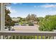 Charming balcony offers views of the street with trees, creating a pleasant and inviting outdoor space at 311 1St Sw Ave, Largo, FL 33770