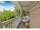 Cozy balcony seating area featuring a comfortable egg chair and a neutral palette perfect for relaxing outdoors at 311 1St Sw Ave, Largo, FL 33770