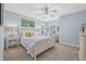 Comfortable bedroom with lots of light features soft blue walls, stylish bedding and ample space for relaxing at 311 1St Sw Ave, Largo, FL 33770