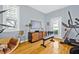 Bright workout room with hardwood floors and exercise equipment, including a treadmill and weights at 311 1St Sw Ave, Largo, FL 33770