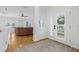 Spacious foyer with hardwood floors and view into the living room and front yard at 311 1St Sw Ave, Largo, FL 33770