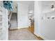 Bright foyer with hardwood floors, staircase, and view into the kitchen at 311 1St Sw Ave, Largo, FL 33770