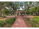 Charming gazebo nestled within a lush, green community park with brick walkway at 311 1St Sw Ave, Largo, FL 33770
