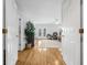Hardwood hallway view into bright living room with lots of natural light at 311 1St Sw Ave, Largo, FL 33770