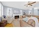Cozy living room with fireplace, large sofa, hardwood floors, and plenty of natural light at 311 1St Sw Ave, Largo, FL 33770
