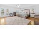Bright main bedroom with ceiling fan, hardwood floors, and lots of natural light at 311 1St Sw Ave, Largo, FL 33770