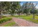 Picturesque community park with brick walkways and mature trees providing ample shade at 311 1St Sw Ave, Largo, FL 33770