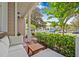 Cozy porch with outdoor seating, views of the yard, and mature trees at 311 1St Sw Ave, Largo, FL 33770