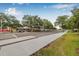 Street view featuring sidewalks, landscaping, and surrounding businesses in the community at 311 1St Sw Ave, Largo, FL 33770