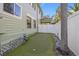 Well-maintained backyard featuring a putting green and partial fence at 3114 W Granada St, Tampa, FL 33629