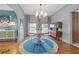 Charming dining room features stylish lighting, modern chairs, and colorful decor with hardwood flooring at 3114 W Granada St, Tampa, FL 33629