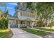 Charming two-story home with a welcoming front porch and a well-manicured front yard at 3114 W Granada St, Tampa, FL 33629