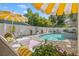 Relaxing backyard pool area with lush landscaping, lounge seating, and a stylish design at 3114 W Granada St, Tampa, FL 33629