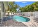 Beautiful backyard pool with spa, brick patio, and well-maintained landscaping for private relaxation and enjoyment at 3114 W Granada St, Tampa, FL 33629