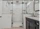 Double shower featuring dual shower heads, white marble tile and glass doors at 3114 W Granada St, Tampa, FL 33629