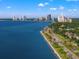 Scenic waterfront view featuring blue water, buildings on the horizon and roadways at 3114 W Granada St, Tampa, FL 33629