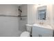 Updated bathroom featuring modern tiled walls, glass mosaic accents, and a sleek vanity at 3145 Domino Dr, Holiday, FL 34691