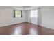 Relaxing bedroom features hardwood floors, closet, and lots of natural light at 3145 Domino Dr, Holiday, FL 34691