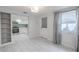 Open layout with tile floors connects the kitchen and living room creating a spacious design at 3145 Domino Dr, Holiday, FL 34691