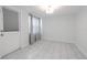 Bright living room boasts tile flooring and a slider leading to the yard at 3145 Domino Dr, Holiday, FL 34691