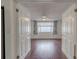 Inviting living room featuring hardwood floors and lots of natural light from the large window at 3145 Domino Dr, Holiday, FL 34691
