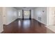 Spacious living room featuring hardwood floors, and a bright, neutral paint palette at 3145 Domino Dr, Holiday, FL 34691