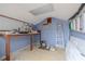 Interior of storage shed with work table, peg board, ladder and supplies at 3145 Domino Dr, Holiday, FL 34691