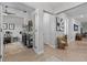 Hallway featuring an display case with curios and wall art, enhanced by natural light at 31921 Magna Gulf Loop, San Antonio, FL 33576