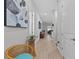 Inviting hallway featuring modern flooring, stylish decor, and ample natural light at 31921 Magna Gulf Loop, San Antonio, FL 33576