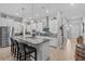 Modern kitchen featuring stainless steel appliances, granite countertops, and a large center island at 31921 Magna Gulf Loop, San Antonio, FL 33576