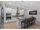 Kitchen with granite countertops, island, and stainless steel appliances at 31921 Magna Gulf Loop, San Antonio, FL 33576