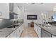 Bright kitchen featuring stainless steel appliances, granite countertops, and neutral finishes at 31921 Magna Gulf Loop, San Antonio, FL 33576
