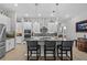 Modern kitchen with stainless steel appliances, gray backsplash, and granite countertops at 31921 Magna Gulf Loop, San Antonio, FL 33576