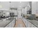 Modern kitchen with granite countertops and stainless steel appliances at 31921 Magna Gulf Loop, San Antonio, FL 33576