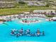 An overhead view of the lagoon showing inflatable slides and beach sand at 31921 Magna Gulf Loop, San Antonio, FL 33576