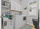 Bright laundry room with washer, dryer, and storage cabinets at 31921 Magna Gulf Loop, San Antonio, FL 33576