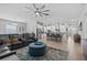 Open concept living room and kitchen area with stylish furnishings at 31921 Magna Gulf Loop, San Antonio, FL 33576